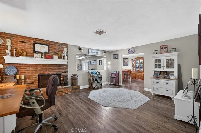 a view of a livingroom with furniture and workspace