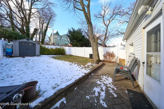 a view of a backyard with sitting area