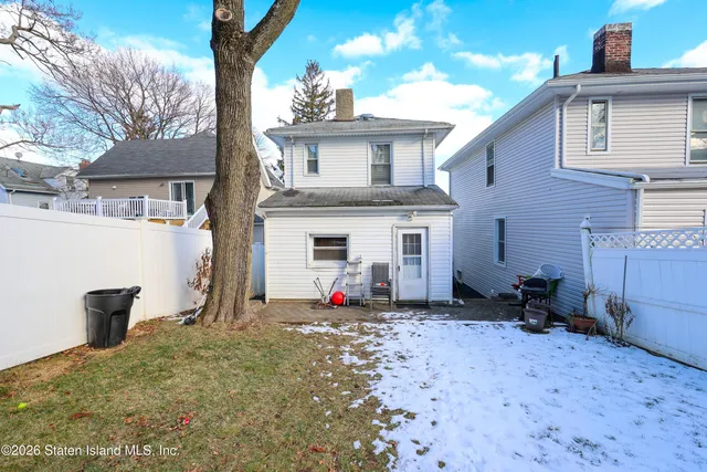 a front view of a house with umbrella