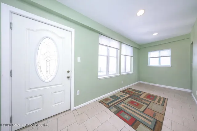 a view of an empty room and a window