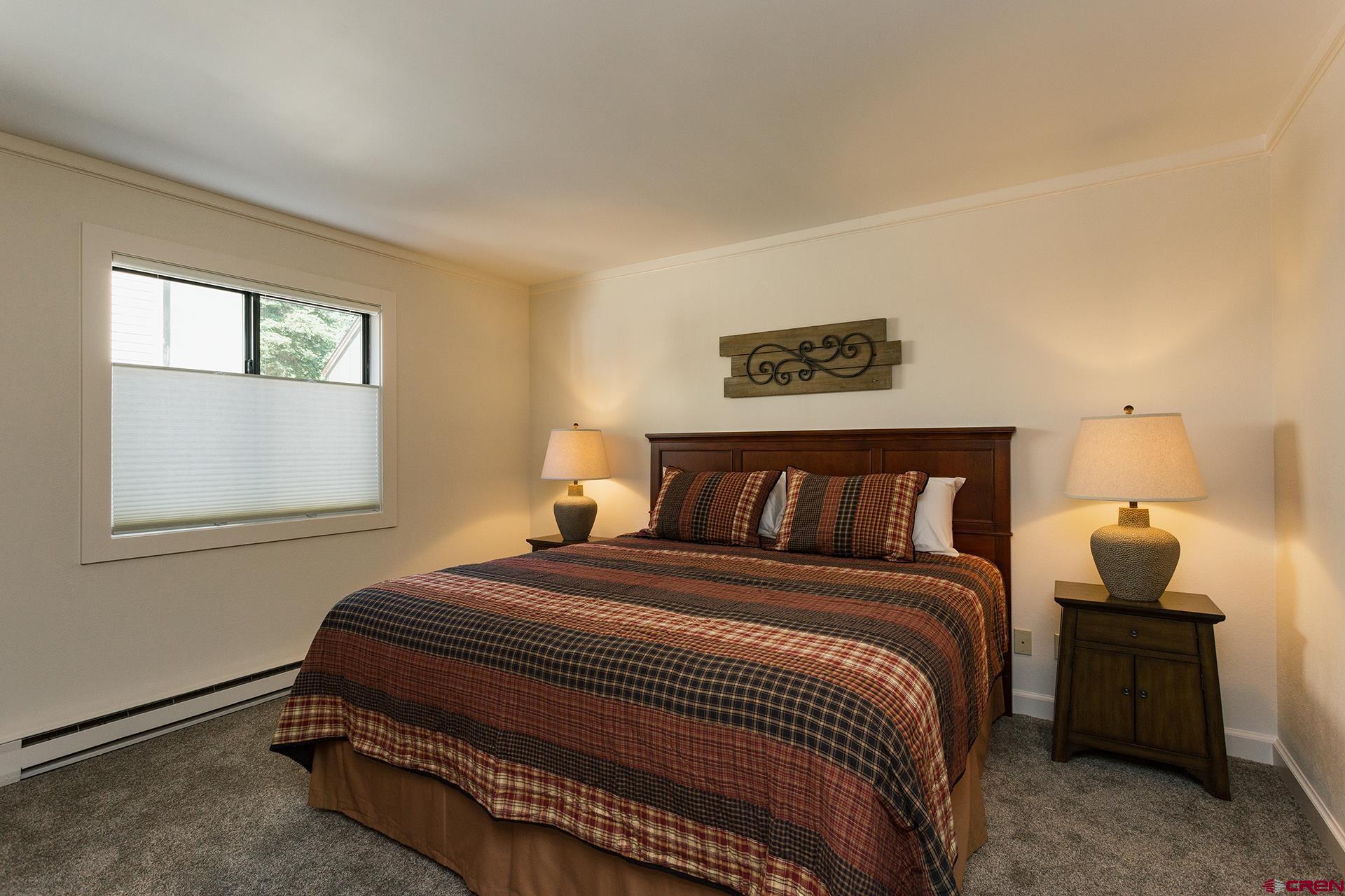 460 Sheol Street, Unit 17 Durango, CO 81301 - Photo 12 of 29 a bedroom with a bed and window