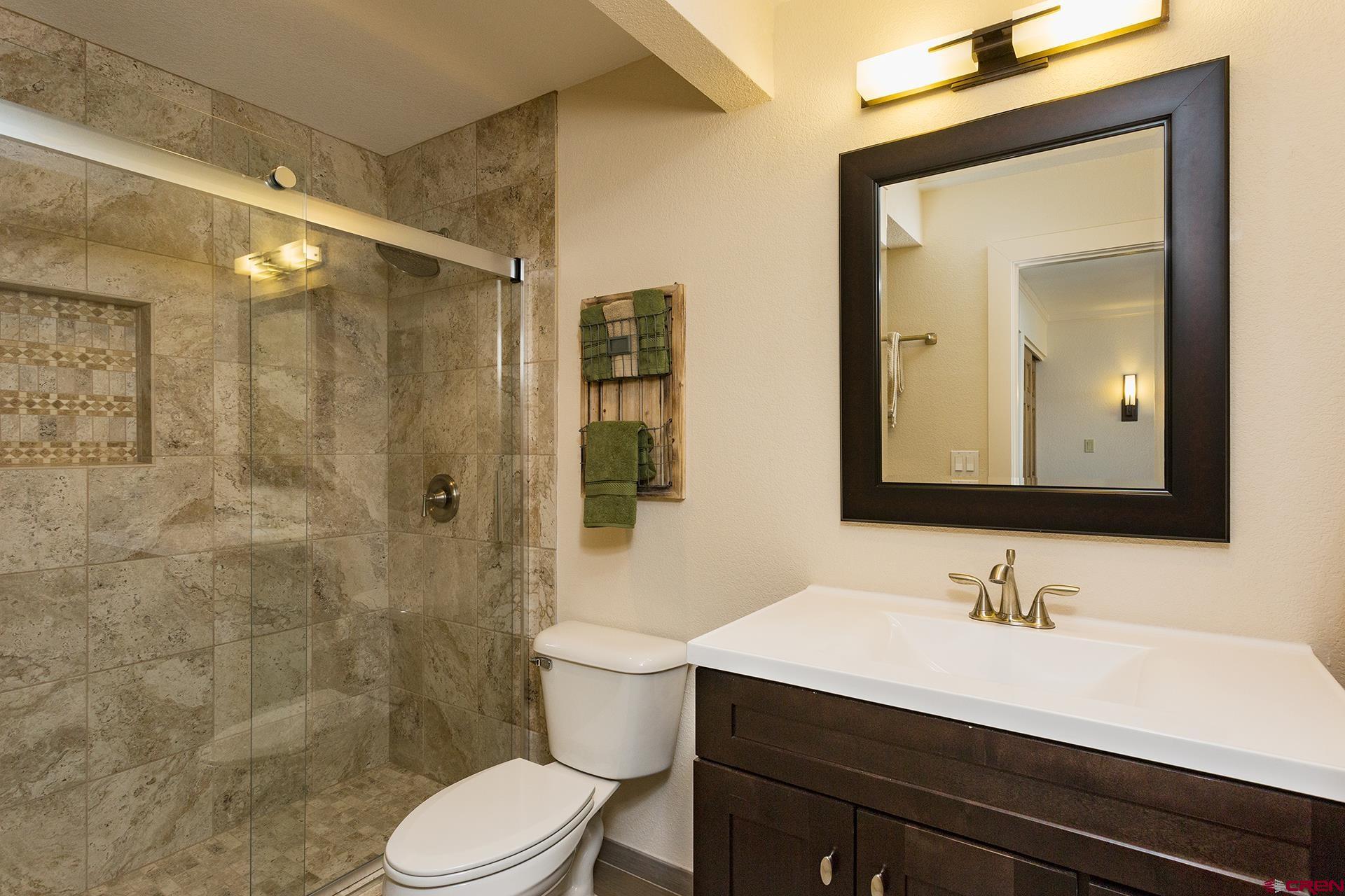 460 Sheol Street, Unit 17 Durango, CO 81301 - Photo 13 of 29 a bathroom with a sink a toilet and shower