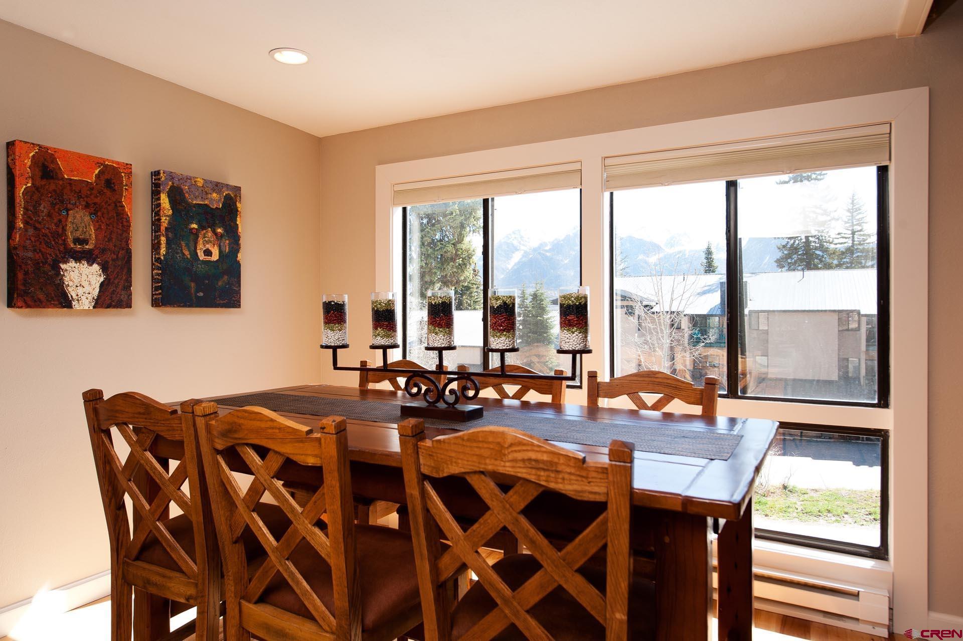 460 Sheol Street, Unit 17 Durango, CO 81301 - Photo 5 of 29 a dining room with furniture a large window and a chandelier