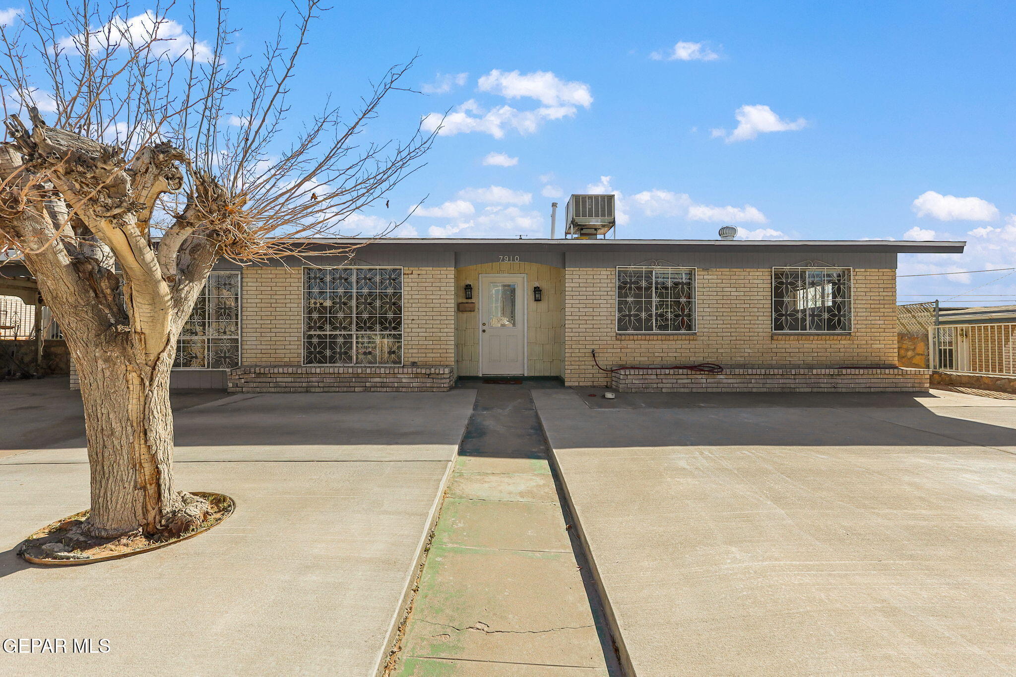 7910 Ranchland Drive El Paso, TX 79915 - Photo 1 of 1 a front view of a house with yard