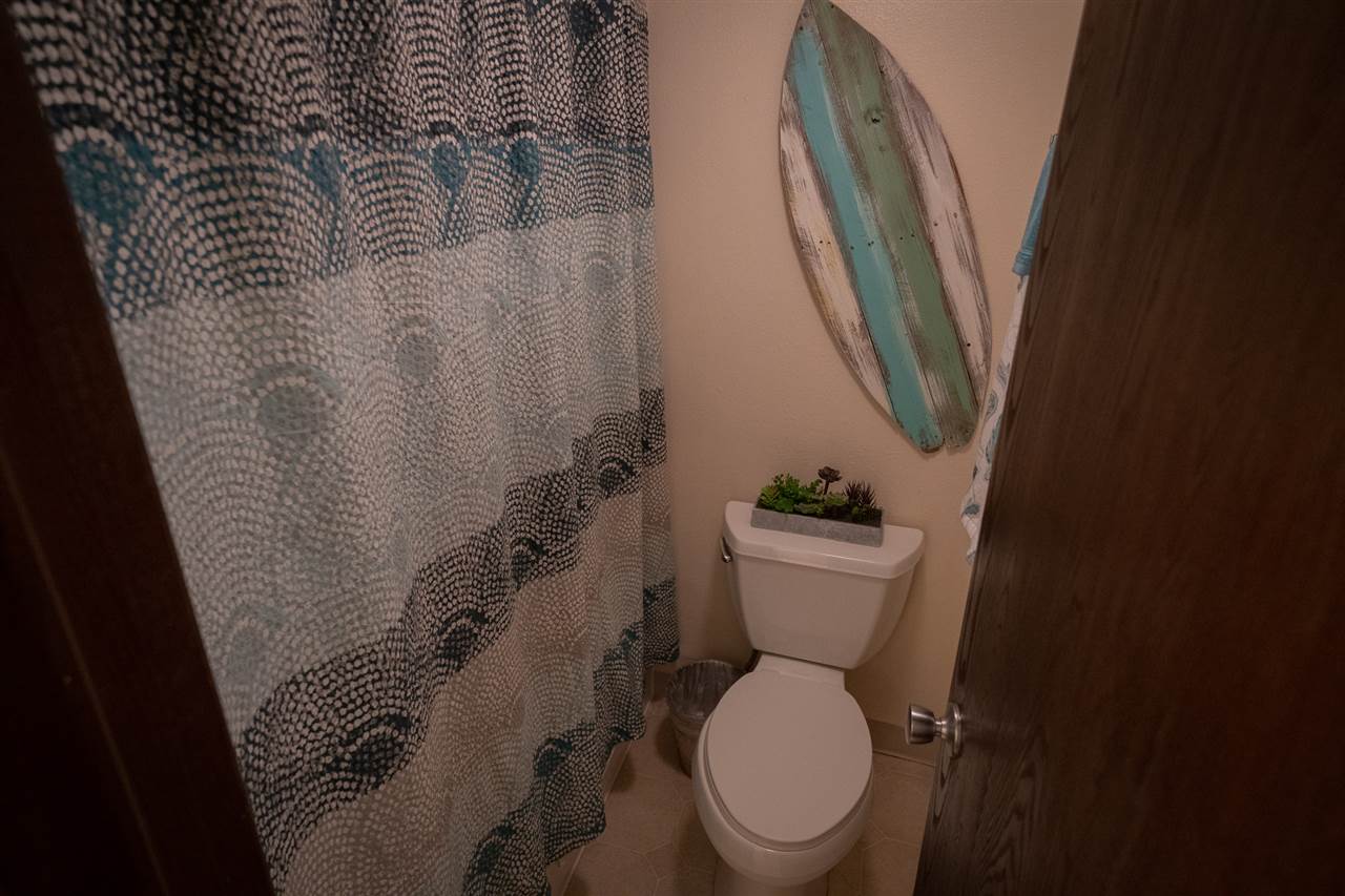 2531 South Kihei Road, Unit DG06 Kihei, HI 96753 - Photo 16 of 16 a white toilet sitting next to a small sink