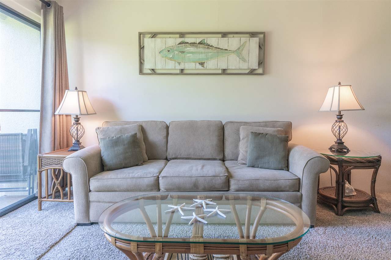 2531 South Kihei Road, Unit DG06 Kihei, HI 96753 - Photo 7 of 16 a living room with furniture and a lamp