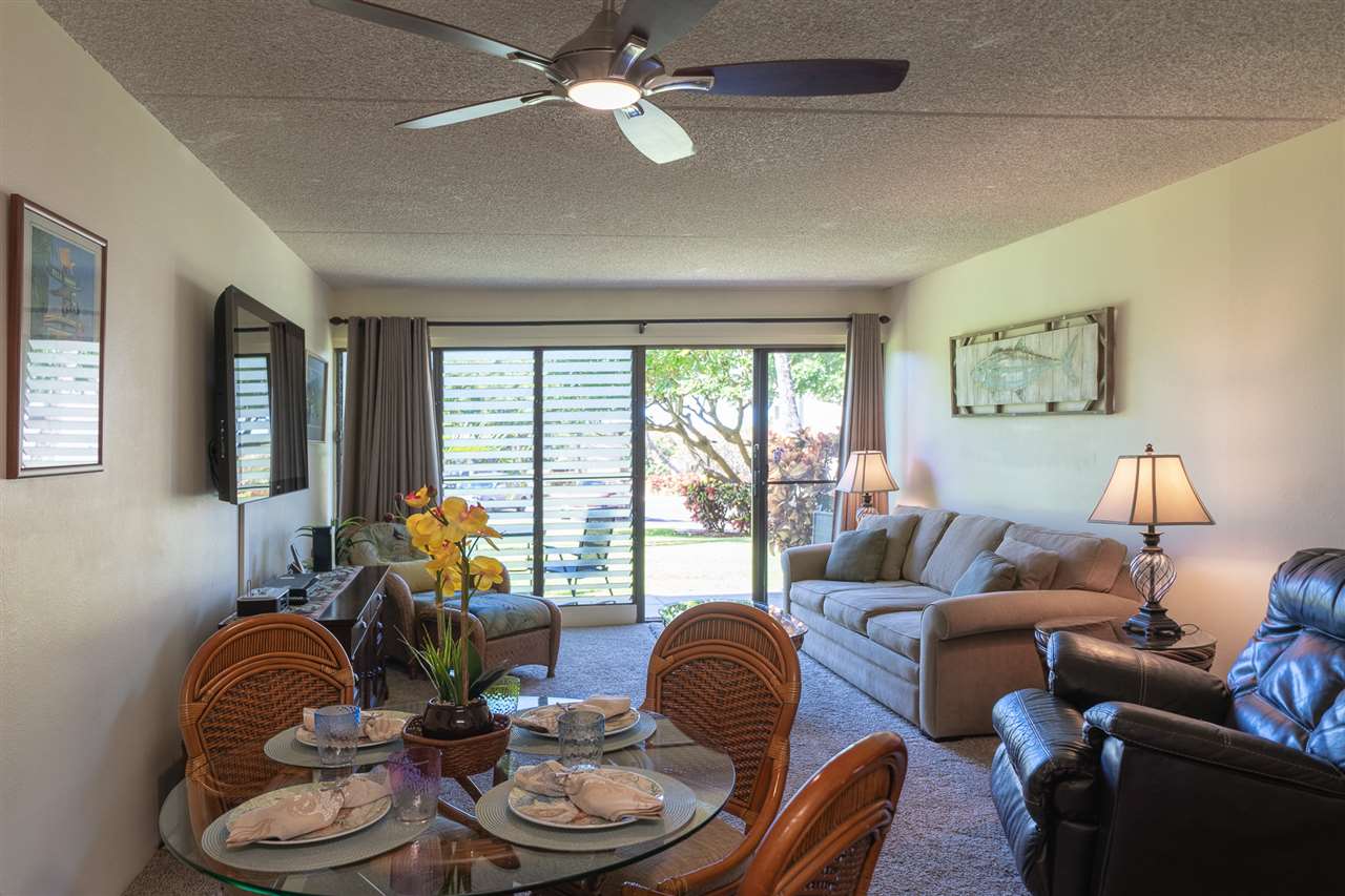 2531 South Kihei Road, Unit DG06 Kihei, HI 96753 - Photo 8 of 16 a living room with furniture and a large window