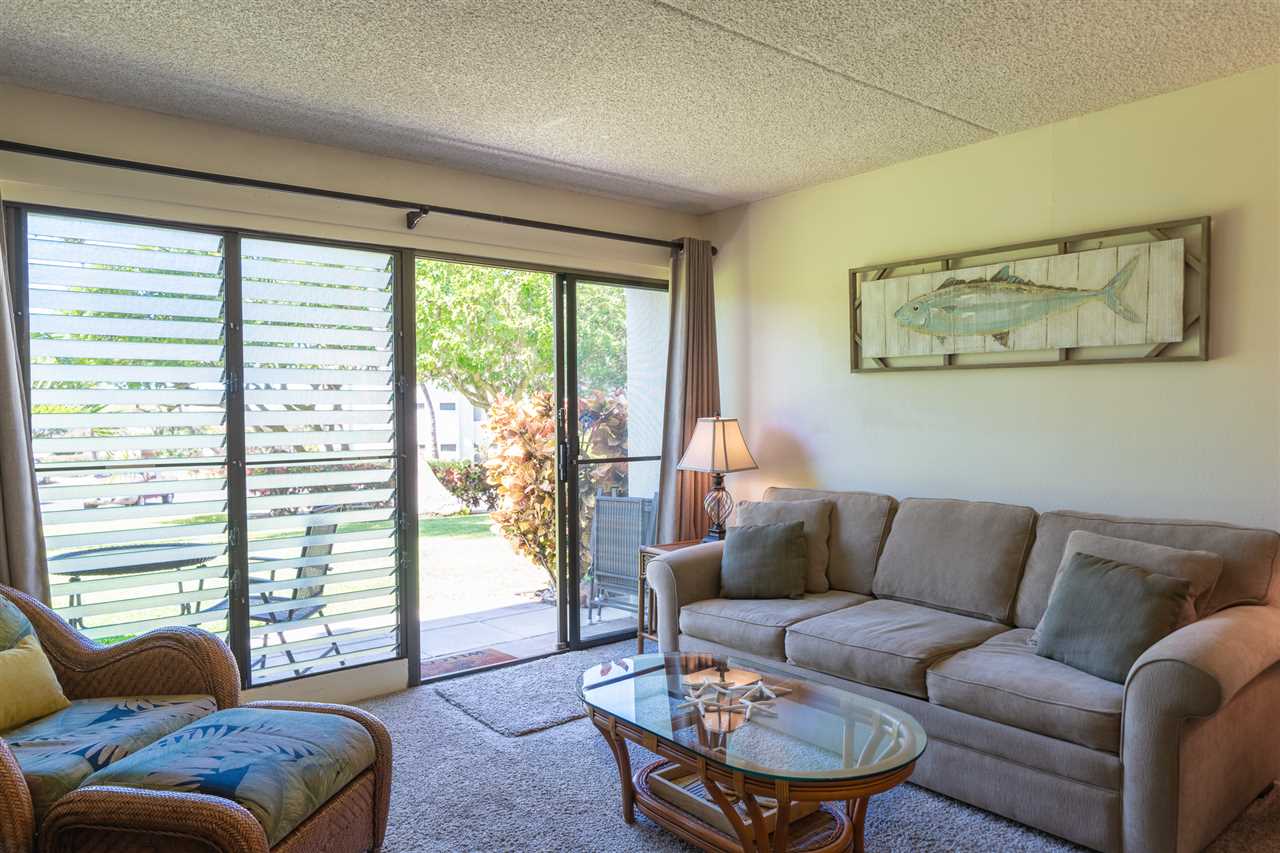 2531 South Kihei Road, Unit DG06 Kihei, HI 96753 - Photo 10 of 16 a living room with furniture and a large window