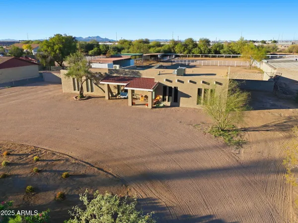 a picture of a room with a white wall and white refrigerator