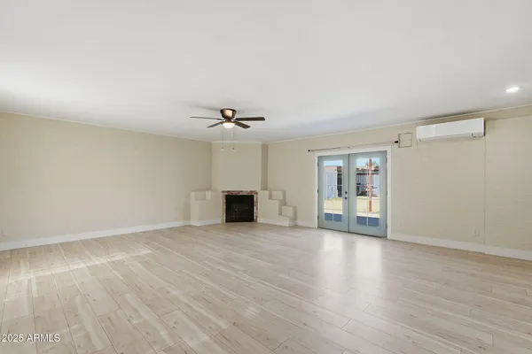 a kitchen with stainless steel appliances kitchen island granite countertop a refrigerator and cabinets