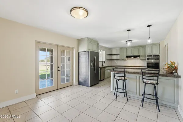 a view of a kitchen with furniture and window