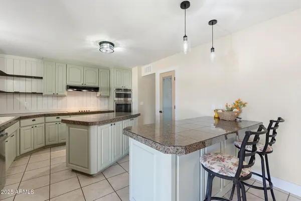 a sink with granite countertop a sink and cabinets