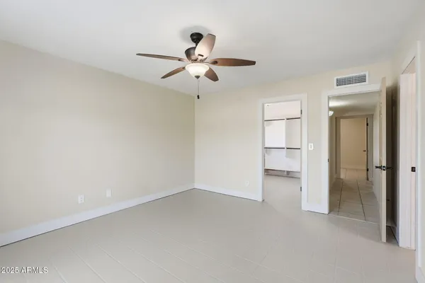 a bathroom with a sink vanity mirror and toilet