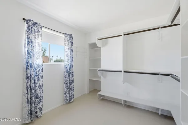 a bathroom with a sink vanity granite and a mirror