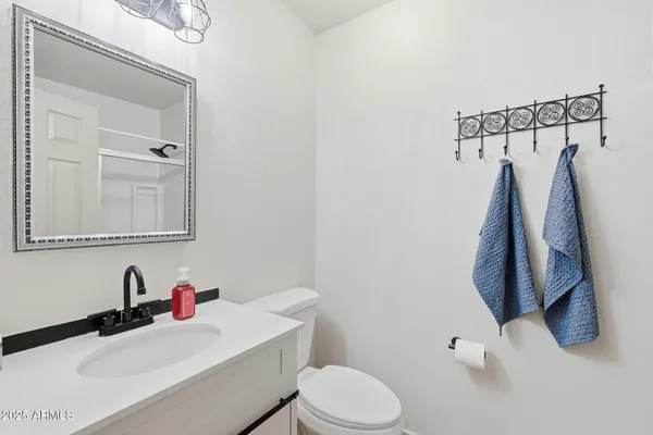 a bathroom with a double vanity sink a mirror and a shower