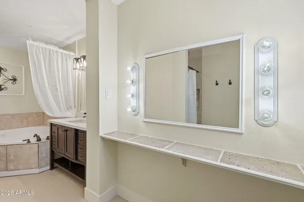 a white house with a yard and a fountain