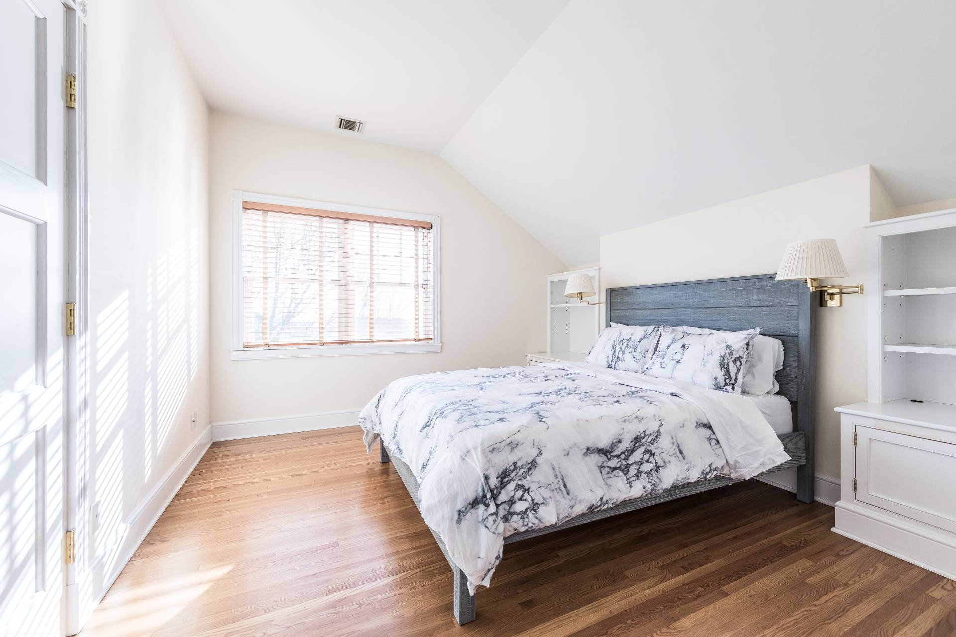 5 Mill Path Bridgehampton, NY 11963 - Photo 15 of 30 a bedroom with a bed and a large window