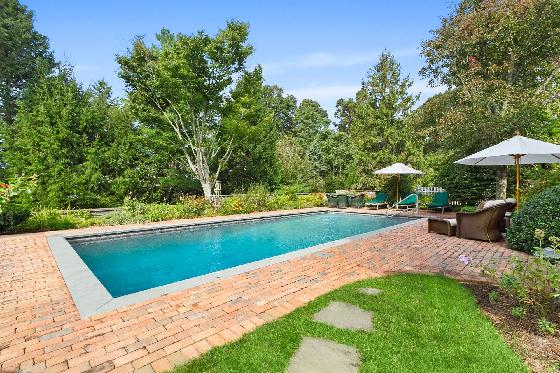 5 Mill Path Bridgehampton, NY 11963 - Photo 27 of 30 a view of a swimming pool with a patio
