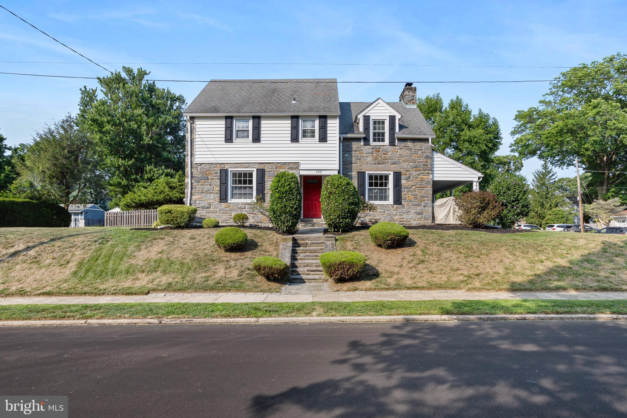 100 Shelburne Road Springfield, PA 19064 - Photo 1 of 31 a front view of a house with garden