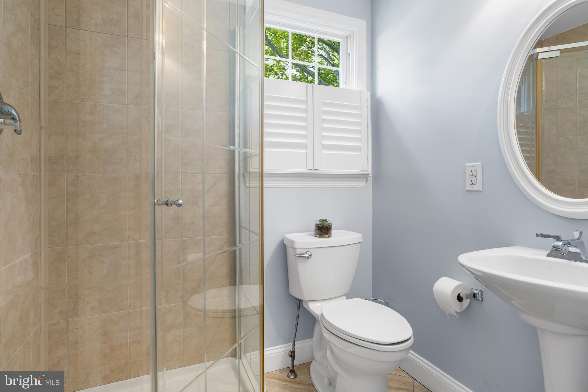 100 Shelburne Road Springfield, PA 19064 - Photo 12 of 31 a white toilet sitting next to a bathroom sink
