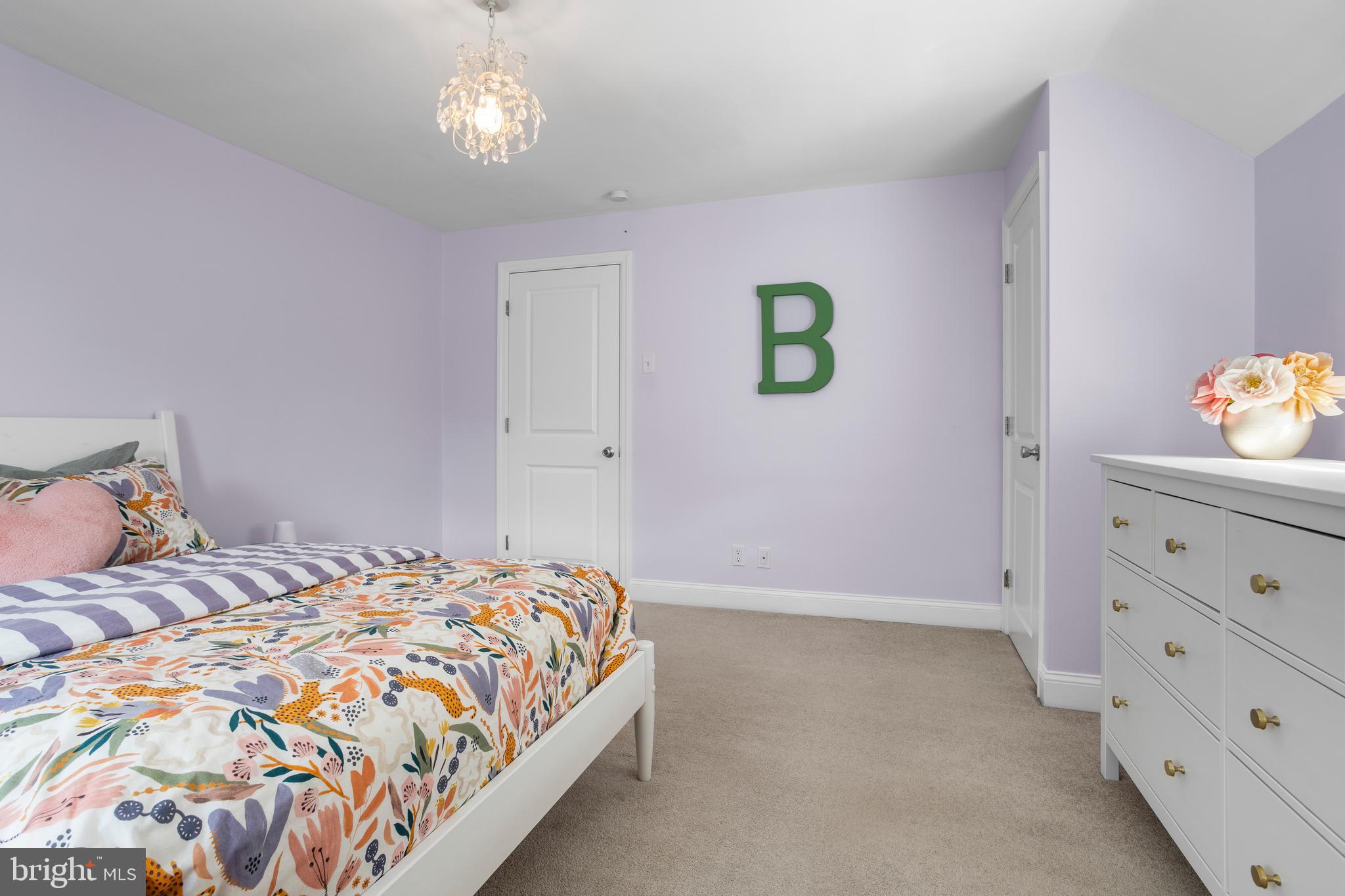 100 Shelburne Road Springfield, PA 19064 - Photo 17 of 31 a bedroom with a bed and a dresser in it