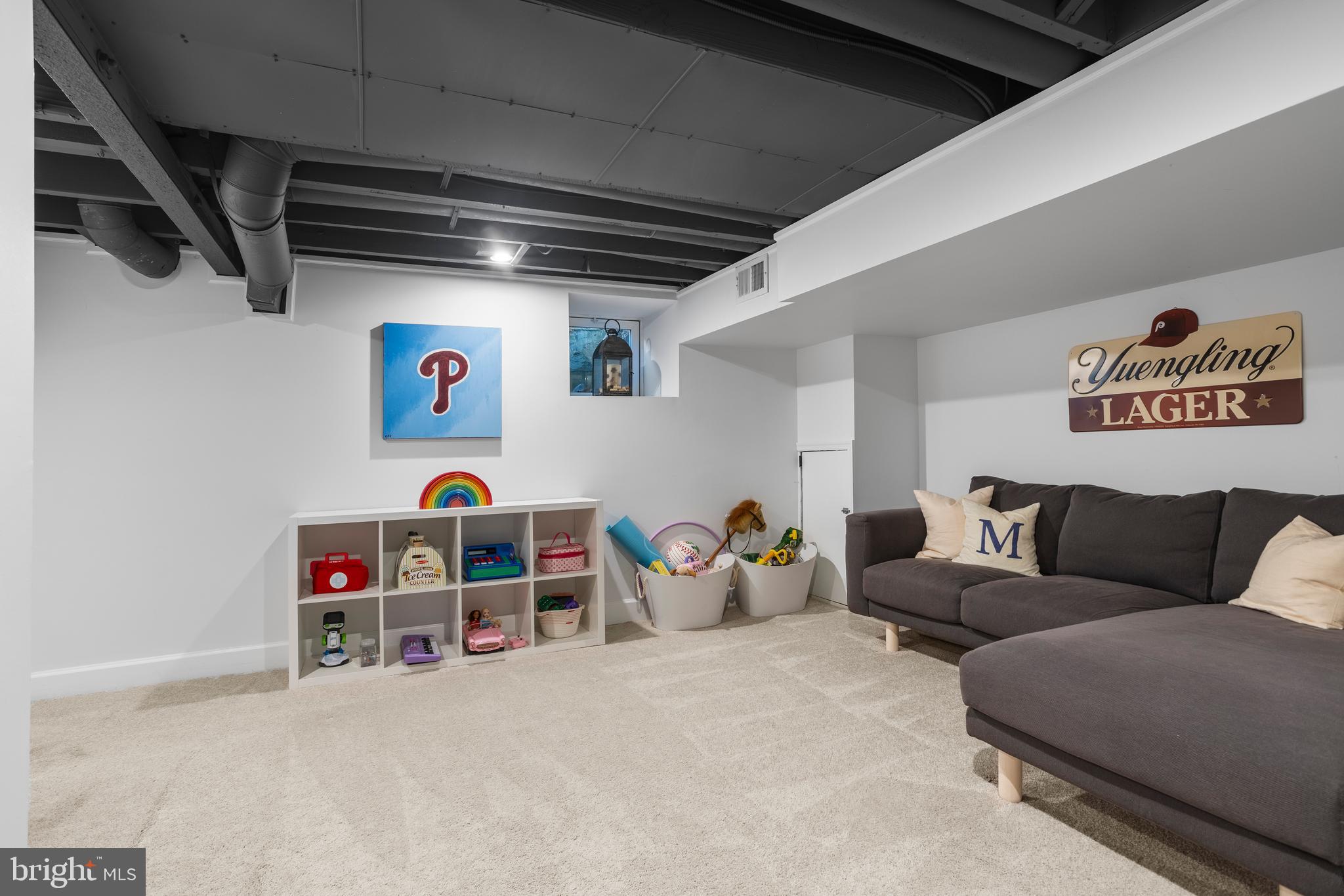 100 Shelburne Road Springfield, PA 19064 - Photo 21 of 31 a living room with furniture and a flat screen tv