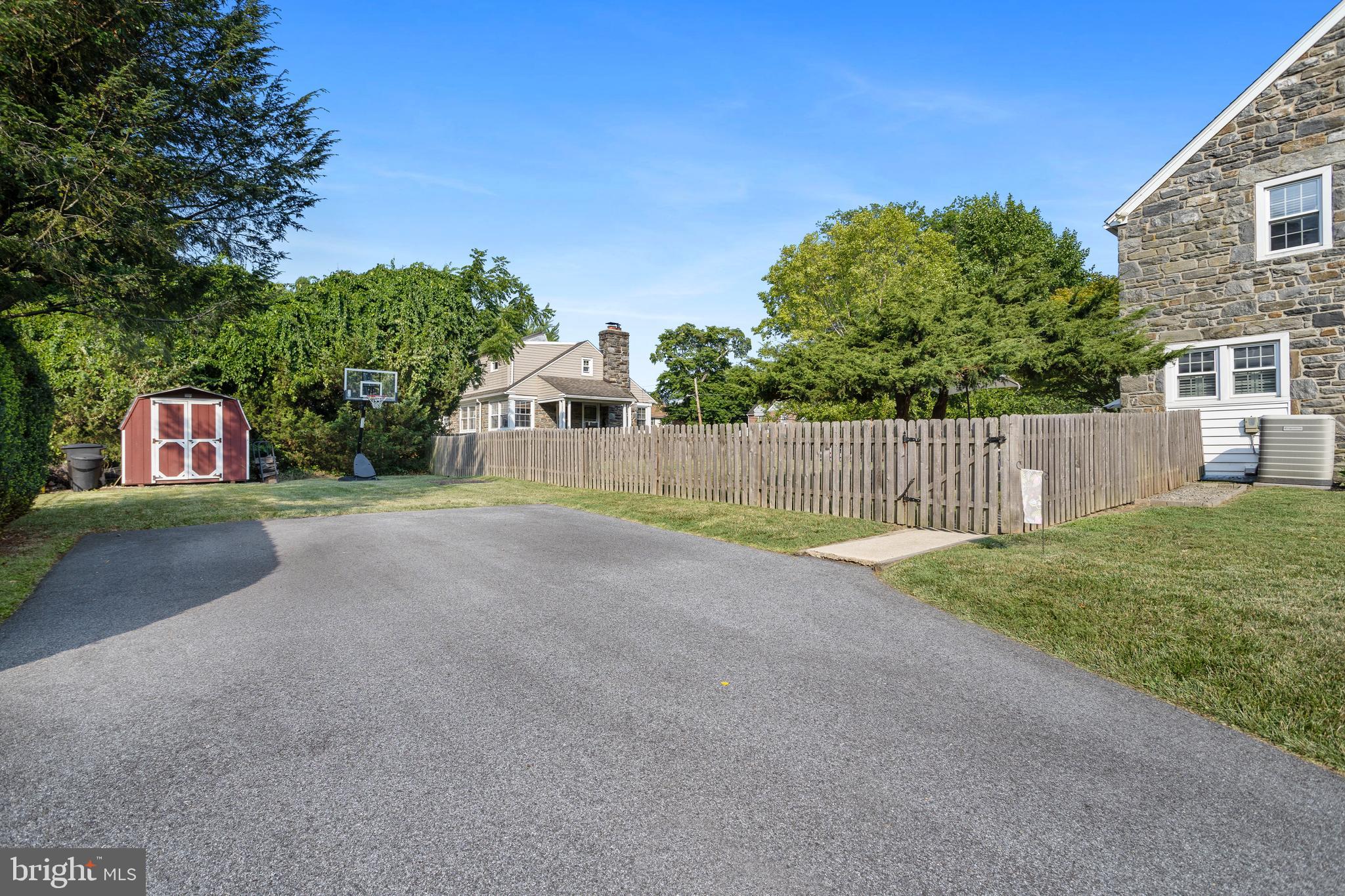 100 Shelburne Road Springfield, PA 19064 - Photo 28 of 31 a view of a street with a large trees