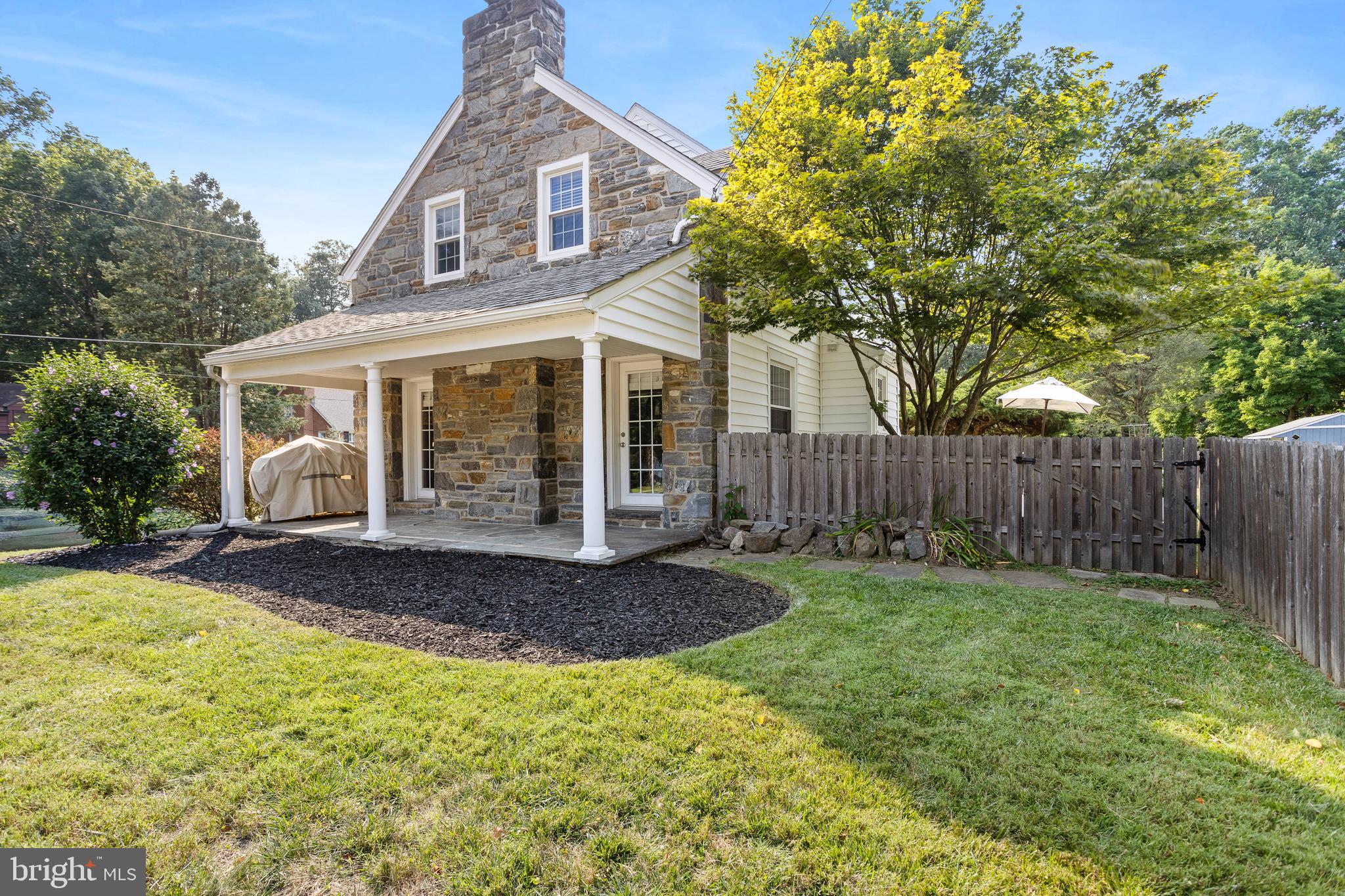 100 Shelburne Road Springfield, PA 19064 - Photo 30 of 31 a front view of a house with a yard and garage