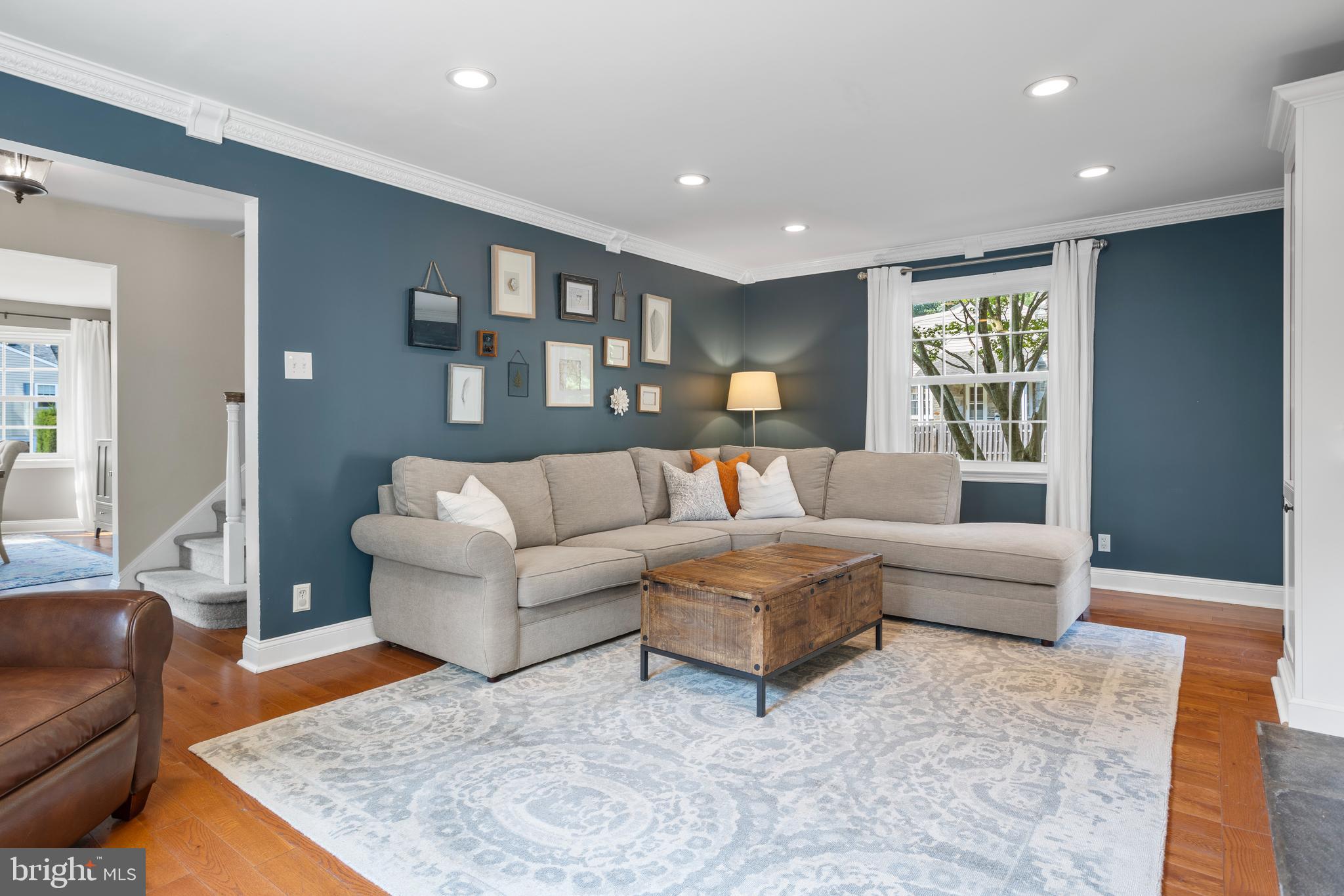 100 Shelburne Road Springfield, PA 19064 - Photo 4 of 31 a living room with furniture and a couch