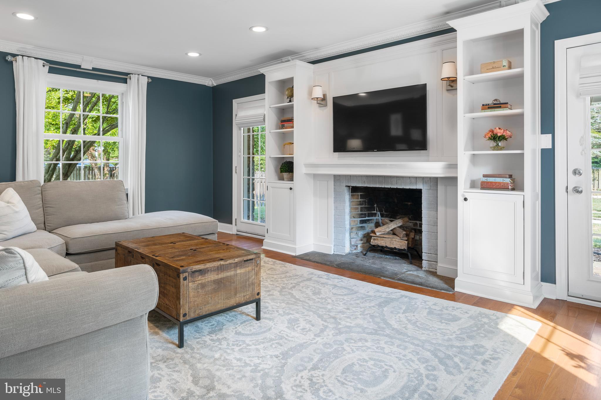 100 Shelburne Road Springfield, PA 19064 - Photo 5 of 31 a living room with furniture and a fireplace