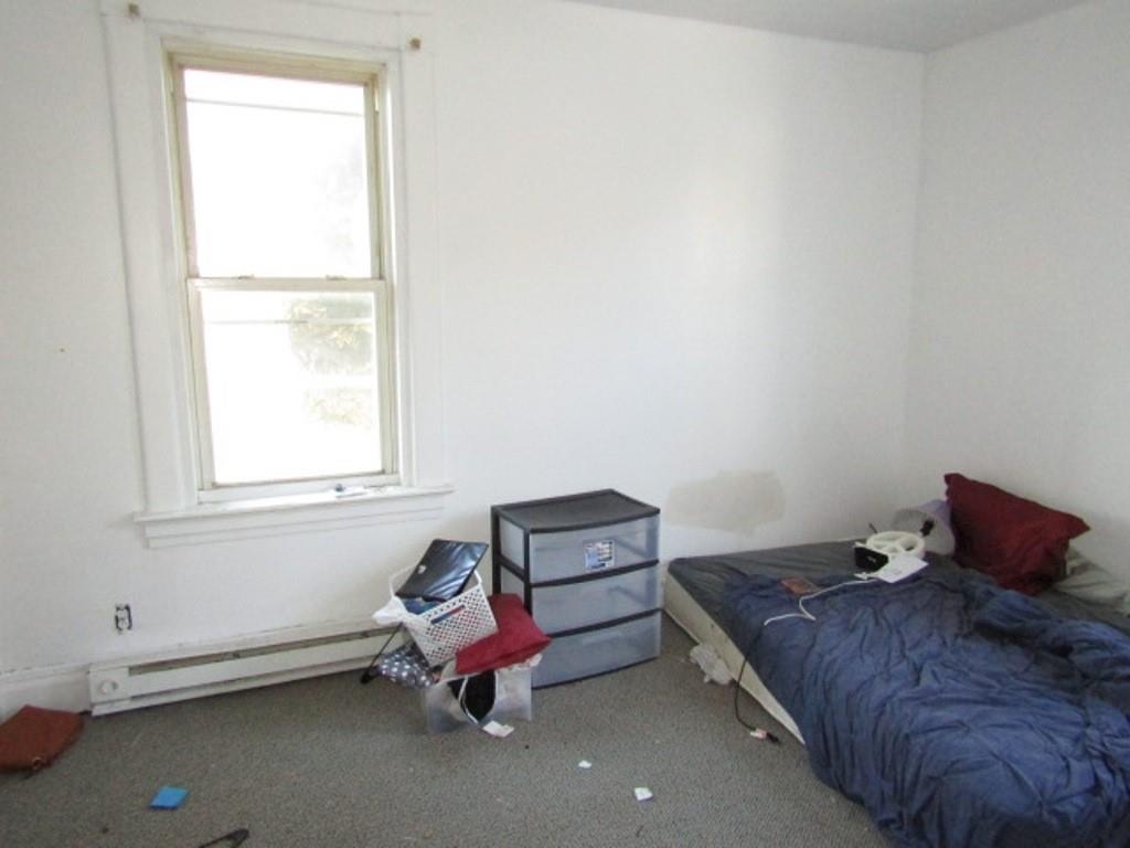 501 9th Street Freedom, PA 15042 - Photo 15 of 25 a bedroom with bed and window