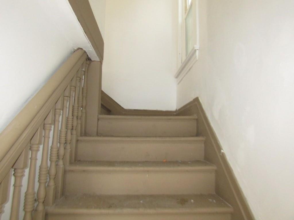 501 9th Street Freedom, PA 15042 - Photo 4 of 25 a view of staircase with white walls and white door