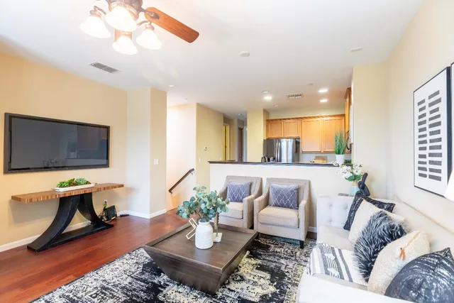 a view of a dining room with furniture and a window