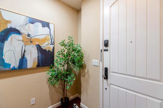 a kitchen with stainless steel appliances granite countertop wooden cabinets a stove a sink and a refrigerator