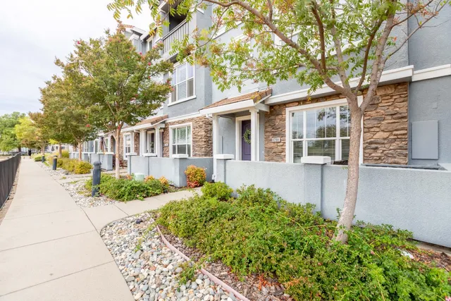 front view of a house with a garden