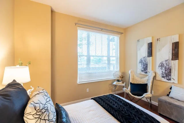 a bed room with a bed and a table