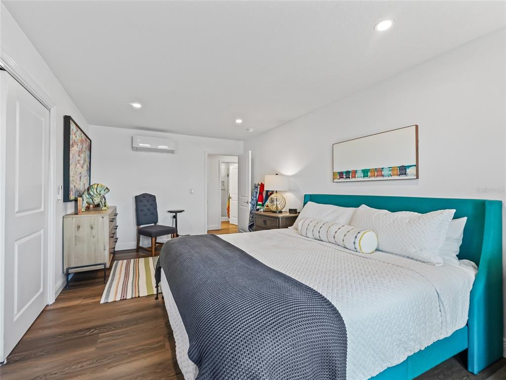 12943 Southeast Sunset Harbor Road Weirsdale, FL 32195 - Photo 73 of 87 a bed room with a bed and a chair