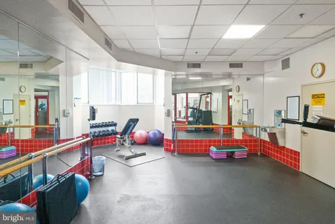 a view of a living room with furniture and wooden floor