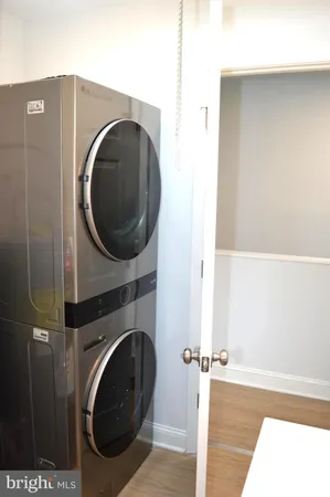 a white toilet sitting next to a white sink