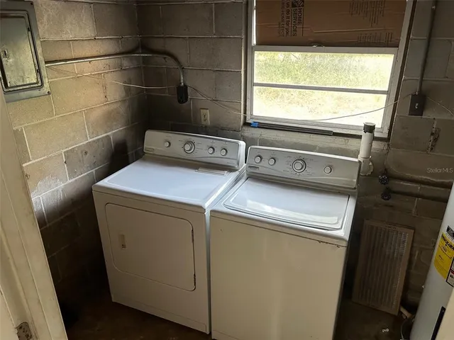 a utility room with dryer and washer