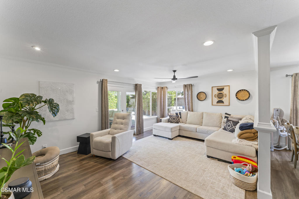3585 Woodhaven Street Simi Valley, CA 93063 - Photo 12 of 33 a living room with furniture and a potted plant