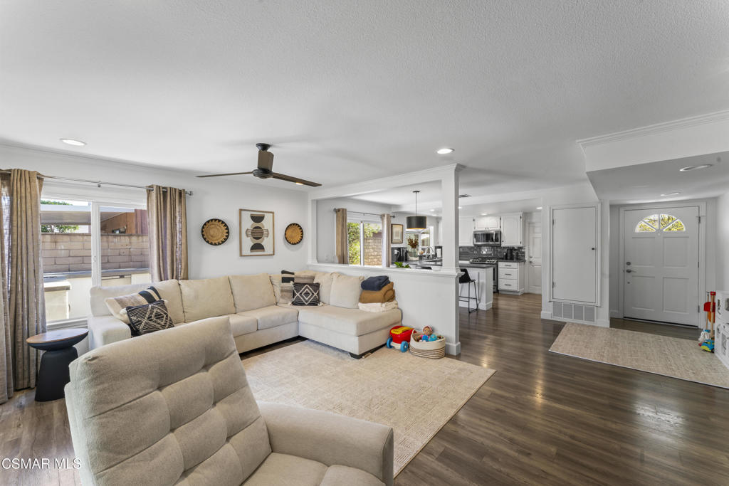 3585 Woodhaven Street Simi Valley, CA 93063 - Photo 13 of 33 a living room with furniture and a large window