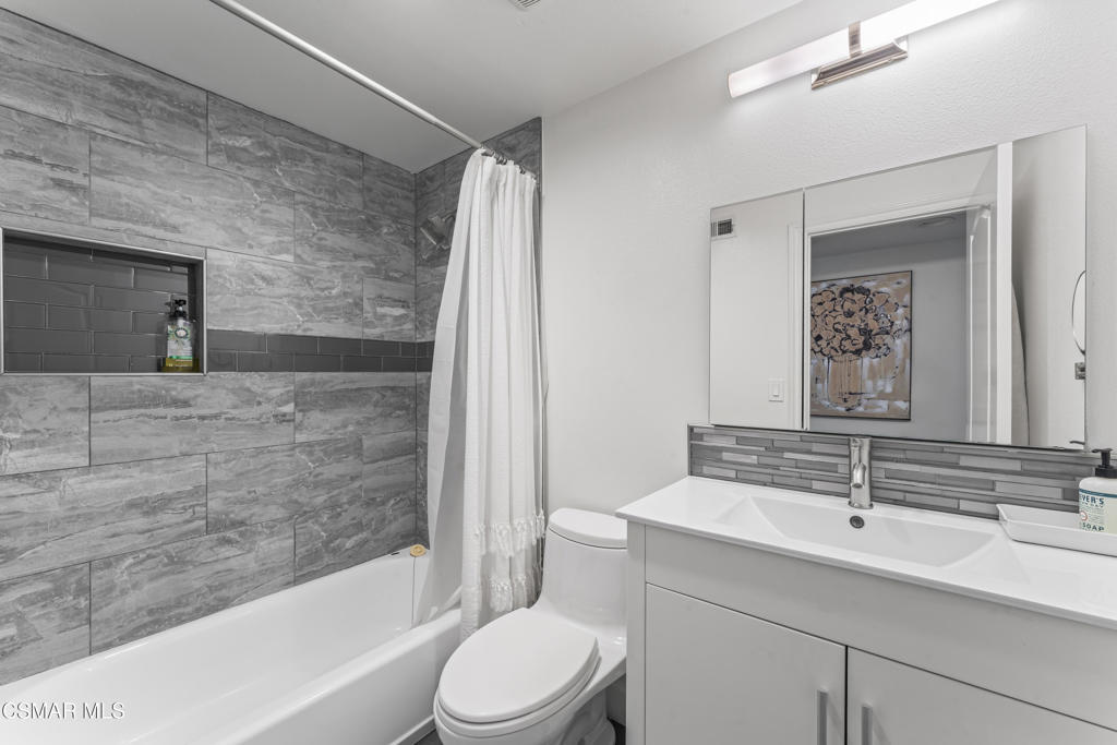 3585 Woodhaven Street Simi Valley, CA 93063 - Photo 19 of 33 a bathroom with a sink a toilet and shower