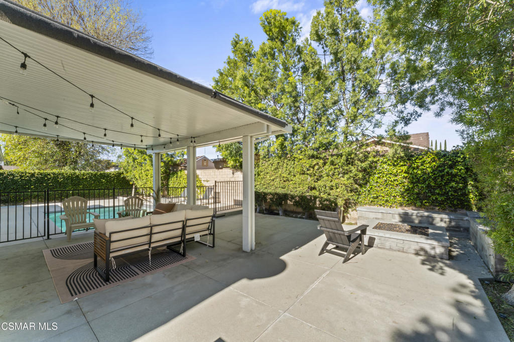 3585 Woodhaven Street Simi Valley, CA 93063 - Photo 25 of 33 a backyard of a house with outdoor seating