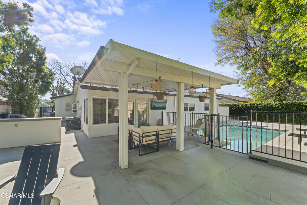 3585 Woodhaven Street Simi Valley, CA 93063 - Photo 26 of 33 a view of a house with a wooden deck and a backyard