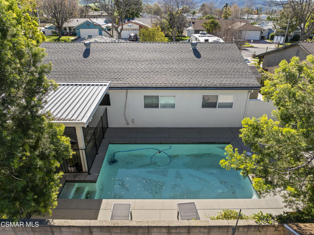 3585 Woodhaven Street Simi Valley, CA 93063 - Photo 3 of 33 an aerial view of a house with a yard