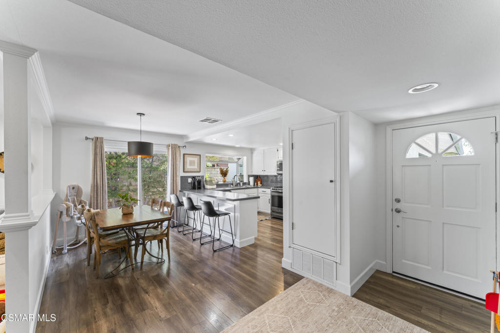 3585 Woodhaven Street Simi Valley, CA 93063 - Photo 9 of 33 a view of a dining room with furniture window and wooden floor