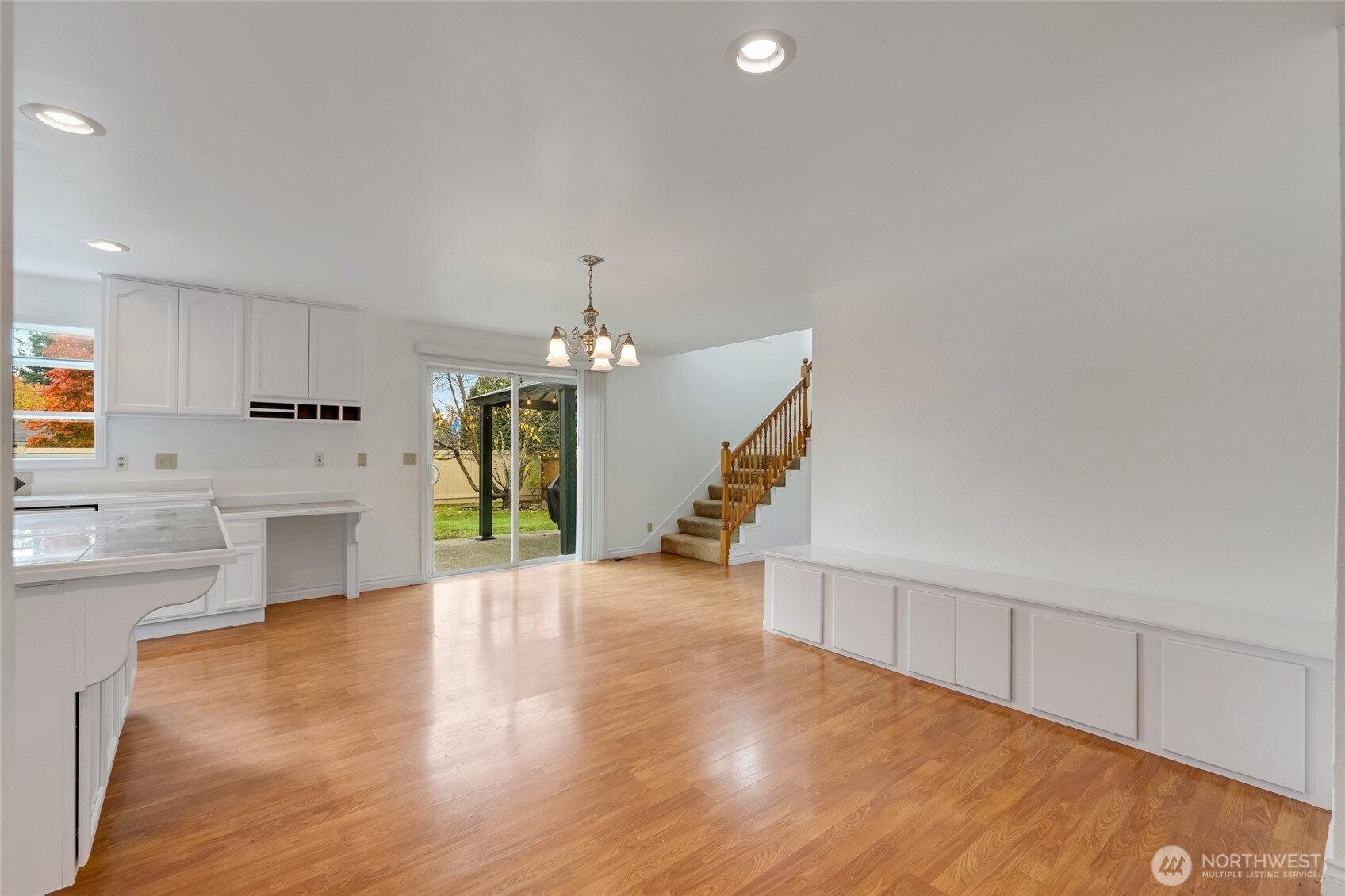 12649 Southeast 169th Place Renton, WA 98058 - Photo 15 of 38 a view of an empty room with a window and wooden floor