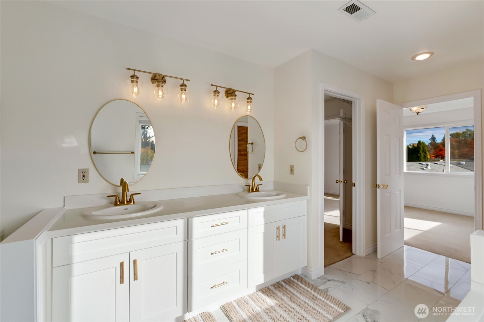 12649 Southeast 169th Place Renton, WA 98058 - Photo 22 of 38 a bathroom with a double vanity sink and a mirror