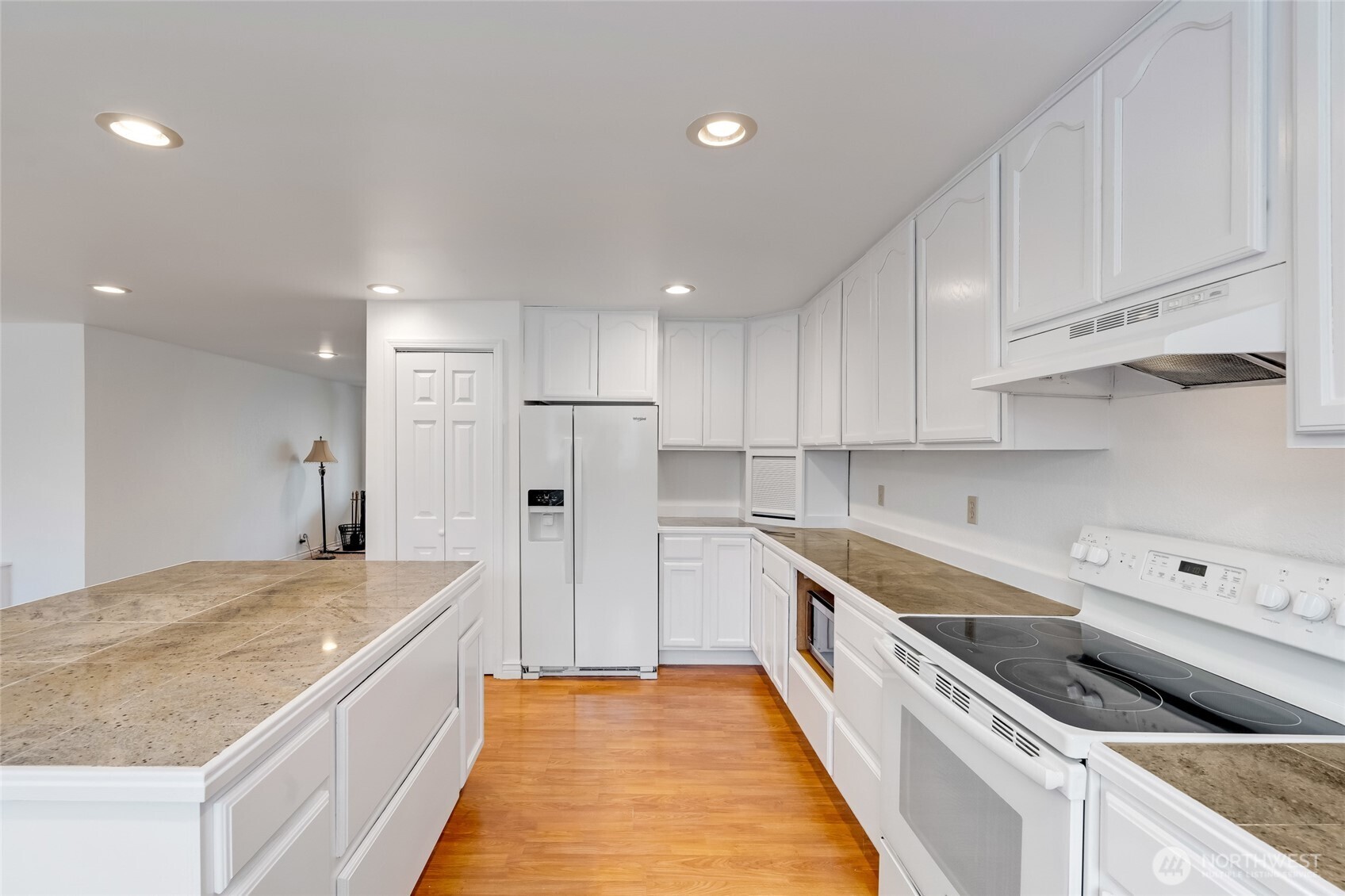 12649 Southeast 169th Place Renton, WA 98058 - Photo 8 of 38 a kitchen with stainless steel appliances a refrigerator sink and cabinets